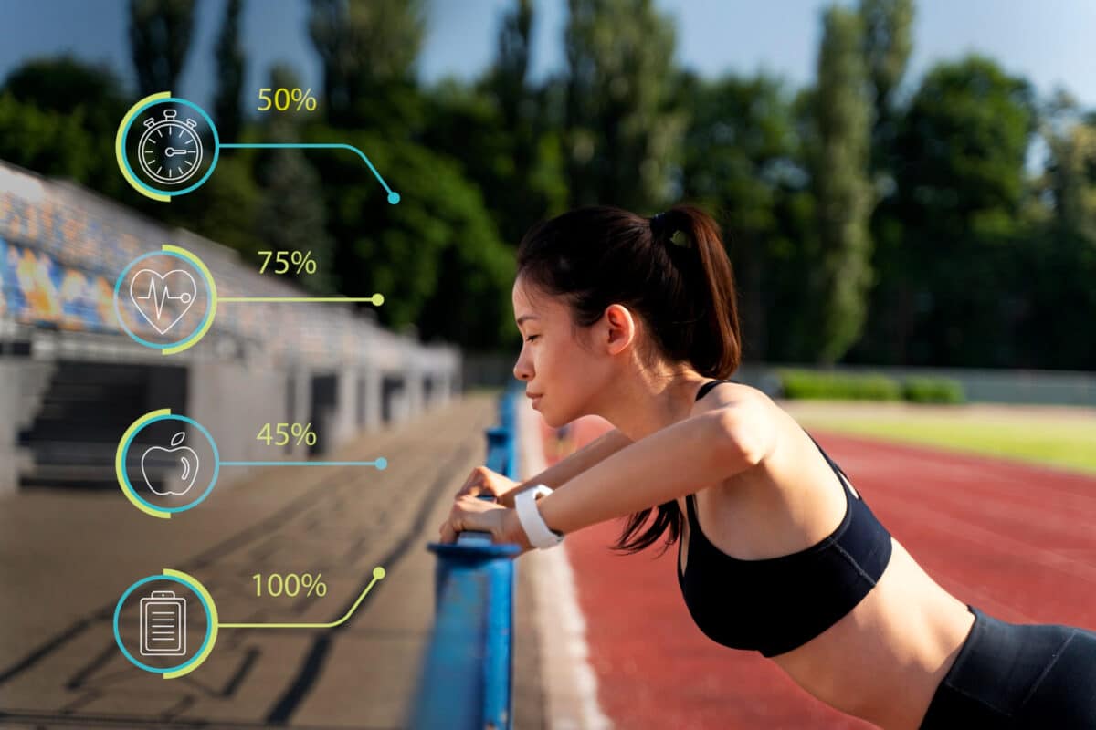 Une athlète utilise des technologies de pointe durant son entraînement : sa montre et divers capteurs corporels affichent en temps réel des données précises comme la fréquence cardiaque, la vitesse, et d'autres mesures de performance.